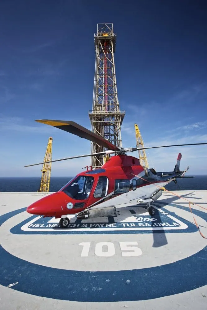 Posterazzi AgustaWestland AW109E helicopter parked on the helipad of an oil rig in the Gulf of Mexico Poster Print, (23 x 34)