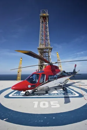 Posterazzi AgustaWestland AW109E helicopter parked on the helipad of an oil rig in the Gulf of Mexico Poster Print, (23 x 34)